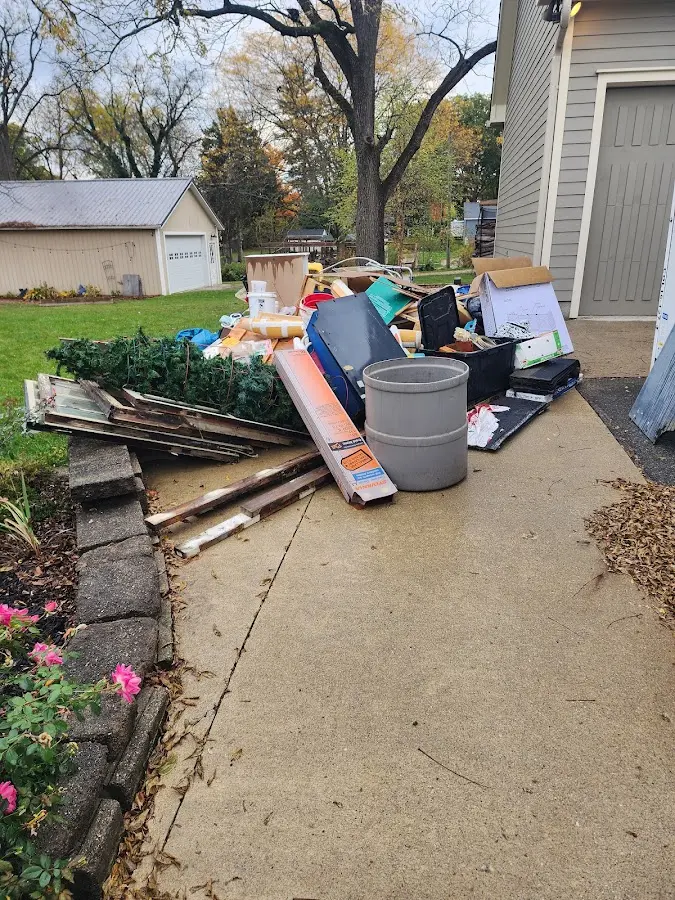 Dumpster being loaded with debris for Roofing Dumpster Rental in Winter Gardens
